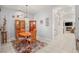 Dining area showcasing elegant chandelier lighting, a wooden table, and an open view into the living space at 7736 Foredawn Dr, Las Vegas, NV 89123