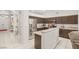 Modern kitchen with stainless steel appliances, granite countertops, and open layout into the living area at 7736 Foredawn Dr, Las Vegas, NV 89123