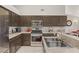 Updated kitchen features stainless steel appliances, granite countertops, and ample cabinet storage at 7736 Foredawn Dr, Las Vegas, NV 89123