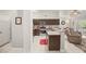 Open kitchen with stainless appliances and granite countertops flows into a casual seating area at 7736 Foredawn Dr, Las Vegas, NV 89123