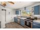 Bright kitchen showcasing stainless steel appliances, a window with natural light, and subway tile backsplash at 7736 Foredawn Dr, Las Vegas, NV 89123