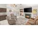 Inviting living room featuring a fireplace, built-in shelves, and comfortable seating at 7736 Foredawn Dr, Las Vegas, NV 89123