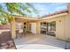 Covered patio with ceiling fan, dining set, and slider door to the interior for seamless indoor/outdoor living at 7736 Foredawn Dr, Las Vegas, NV 89123