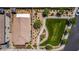 Aerial view of the home, roof, backyard, and the neighborhood park next door at 7824 Warm Winds St, North Las Vegas, NV 89084