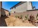 Desert landscaped backyard featuring a brick fence and plenty of space at 7824 Warm Winds St, North Las Vegas, NV 89084