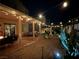 Night view of the backyard featuring a covered patio, desert landscaping and ambient lighting at 7824 Warm Winds St, North Las Vegas, NV 89084