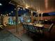 Backyard at night with a covered patio, ambient string lights, and desert landscaping at 7824 Warm Winds St, North Las Vegas, NV 89084