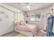 Charming bedroom with whimsical decor, a comfortable bed, and great natural light at 7824 Warm Winds St, North Las Vegas, NV 89084