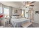 Inviting bedroom with soft lighting, plush bedding, and stylish accents at 7824 Warm Winds St, North Las Vegas, NV 89084