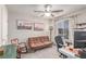 Cozy bedroom featuring comfortable seating, artwork, and a view to the outdoors at 7824 Warm Winds St, North Las Vegas, NV 89084