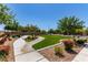 Well-maintained community park with walking paths, benches, and mature trees at 7824 Warm Winds St, North Las Vegas, NV 89084