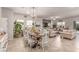 Open-concept with dining area connected to a modern kitchen and living space at 7824 Warm Winds St, North Las Vegas, NV 89084