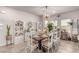 Elegant dining room featuring a dark wood table, seating for six, and stylish decor at 7824 Warm Winds St, North Las Vegas, NV 89084