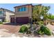 Beautiful two-story home with a two-car garage and well-manicured front yard at 7824 Warm Winds St, North Las Vegas, NV 89084