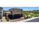 Beautiful two-story home with a brick driveway, well-maintained landscaping, and a two-car garage at 7824 Warm Winds St, North Las Vegas, NV 89084