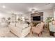 Spacious living room with comfortable seating, decorative accents, and ample natural light at 7824 Warm Winds St, North Las Vegas, NV 89084