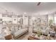 Bright open-concept space with living and dining areas connected to a modern kitchen with stainless steel appliances at 7824 Warm Winds St, North Las Vegas, NV 89084