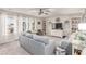 Comfortable living room featuring plush seating, built-in bookshelves, and large windows for natural light at 7824 Warm Winds St, North Las Vegas, NV 89084
