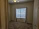 This bedroom includes a ceiling fan and a large window for lots of natural light at 7849 Blue Brook Dr, Las Vegas, NV 89147
