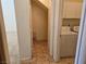 Functional laundry room with washer, dryer, and storage space at 7849 Blue Brook Dr, Las Vegas, NV 89147