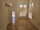 Bright living room features soaring ceilings, tile floors, and abundant natural light at 7849 Blue Brook Dr, Las Vegas, NV 89147