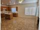 Open-concept living area features tile floors, fireplace, and ample natural light at 7849 Blue Brook Dr, Las Vegas, NV 89147