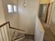 The staircase is carpeted and provides access to the upper and lower levels of the home at 7849 Blue Brook Dr, Las Vegas, NV 89147