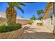 The backyard has lovely plants and a brick wall around the perimeter at 8078 Leather Harness St, Las Vegas, NV 89131
