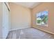 Cozy bedroom with plush carpeting, neutral walls, and a large window offering a view at 8078 Leather Harness St, Las Vegas, NV 89131