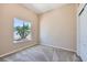 Well-lit bedroom featuring carpet, closet with sliding doors, and large window at 8078 Leather Harness St, Las Vegas, NV 89131