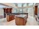 Spacious kitchen has granite countertops, stainless appliances, wood cabinets, and a center island at 8078 Leather Harness St, Las Vegas, NV 89131