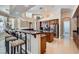 Gourmet kitchen boasts granite counters, a breakfast bar, wood cabinetry, and stainless steel appliances at 8078 Leather Harness St, Las Vegas, NV 89131