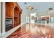 Spacious living room features hardwood floors, a fireplace, built-in shelves, and backyard access at 8078 Leather Harness St, Las Vegas, NV 89131