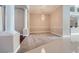Cozy living room with elegant chandelier, decorative columns, and transition to dining area at 8078 Leather Harness St, Las Vegas, NV 89131
