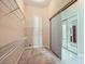 Walk-in closet with built-in shelving and sliding mirrored doors, offering ample storage space at 8078 Leather Harness St, Las Vegas, NV 89131