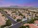 Stunning aerial view of a neighborhood showcasing well-maintained homes and mature landscaping at 8100 Lake Hills Dr, Las Vegas, NV 89128