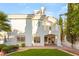 A charming home backyard showcasing a well-manicured lawn and lush landscaping at 8100 Lake Hills Dr, Las Vegas, NV 89128