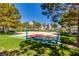 Community basketball court with lush green surroundings, promoting a healthy and active lifestyle at 8100 Lake Hills Dr, Las Vegas, NV 89128