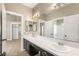 Bright bathroom features double sinks, large mirrors, and separate shower/tub at 8100 Lake Hills Dr, Las Vegas, NV 89128