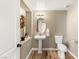 Charming powder room with pedestal sink and decorative accents at 8100 Lake Hills Dr, Las Vegas, NV 89128