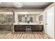Elegant bathroom featuring double vanity, walk in shower, and modern lighting at 8100 Lake Hills Dr, Las Vegas, NV 89128