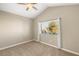 Bedroom featuring carpet flooring, vaulted ceiling, and a window with neighborhood views at 8100 Lake Hills Dr, Las Vegas, NV 89128