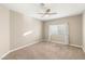 Neutral bedroom with carpet, ceiling fan, and natural light at 8100 Lake Hills Dr, Las Vegas, NV 89128