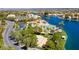 Breathtaking aerial view of lakeside community amenities, including a beach and recreational area at 8100 Lake Hills Dr, Las Vegas, NV 89128