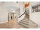 Spacious home entryway featuring a carpeted staircase and decorative wall niches at 8100 Lake Hills Dr, Las Vegas, NV 89128