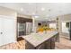 Open kitchen featuring a large island and modern stainless steel appliances at 8100 Lake Hills Dr, Las Vegas, NV 89128