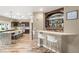 Kitchen bar with wine rack and seating at 8100 Lake Hills Dr, Las Vegas, NV 89128