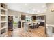 Modern kitchen featuring an island with seating and stainless steel appliances at 8100 Lake Hills Dr, Las Vegas, NV 89128