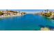 Expansive view of the community lake with beautiful waterfront homes lining the shoreline at 8100 Lake Hills Dr, Las Vegas, NV 89128