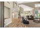 Open-concept living room showcasing high ceilings, modern finishes, and abundant natural light at 8100 Lake Hills Dr, Las Vegas, NV 89128
